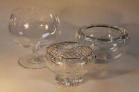 A cut glass rose bowl and two other glass bowls.