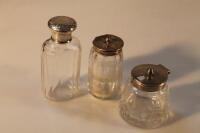 A Victorian glass scent bottle with silver screw off cap