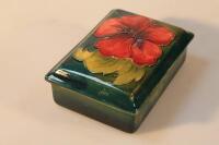 A Moorcroft pottery cigarette box and cover