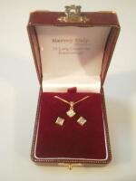 A diamond pendant and earring set