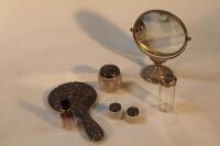 Silver items including a vanity mirror