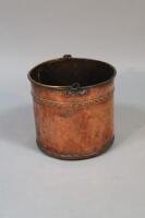 A copper coal bin