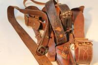 A leather holster belt and Sam Browne leather belts.