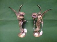 A pair of brass candlesticks