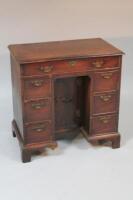 A George III style kneehole desk