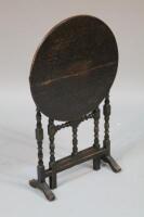 A 19thC oak flip top table
