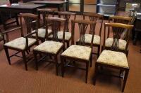 A set of eight Chippendale style dining chairs