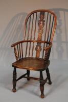 A 19thC elm Windsor armchair.