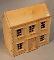 A modern dolls house with furniture and figures