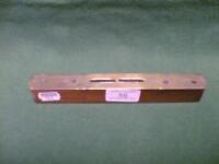 A mahogany and brass spirit level