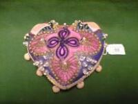 A heart shaped pin cushion