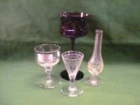 Six wine goblets and other glass