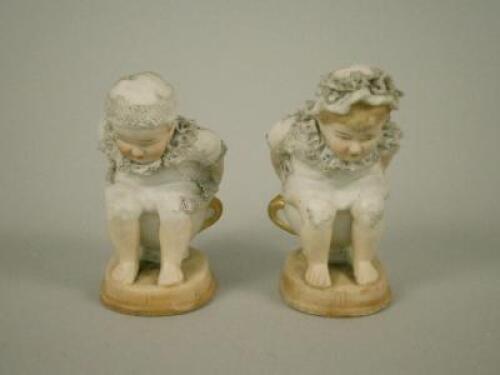 A pair of late 19thC German novelty bisque figures