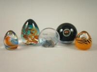 Five modern abstract paperweights.