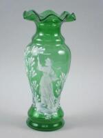 A Mary Gregory decorated green glass vase