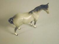 A Beswick figure of a grey horse