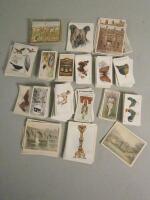 A box containing a large amount of loose cigarette cards.