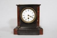 A Victorian polished slate and marble mantel timepiece