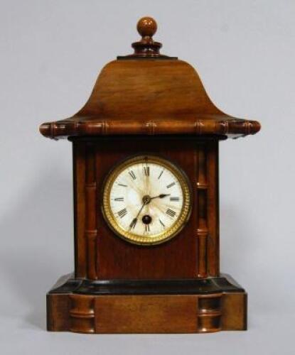 A Victorian ebonised & walnut mantel clock