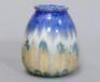 A small dip glazed vase by Ruskin