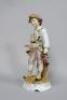 A 19thC German porcelain figure of a boy