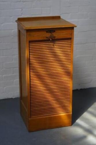 A Lebus light oak music cabinet.