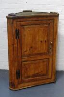 A Georgian pine hanging corner cupboard.