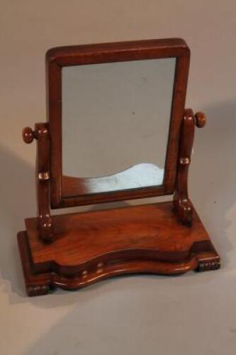 A Victorian walnut toilet mirror