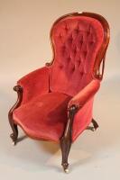 A Victorian mahogany spoonback armchair