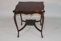 An Edwardian walnut window table