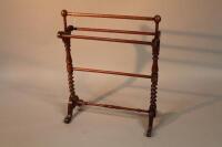 A Victorian barley twist mahogany towel rail.