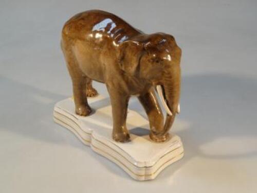 A 19thC Staffordshire pottery figure of an elephant