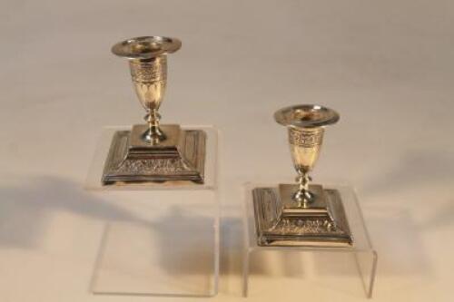 A pair of Victorian silver boudoir candlesticks