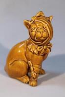 A Bretby style figure pottery figure of a seated bulldog wearing a bandage