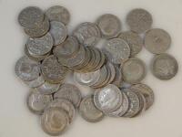 A quantity of George V six penny pieces.