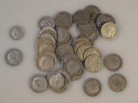 A quantity of George V six penny pieces.