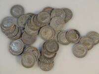 A quantity of George V six penny pieces.