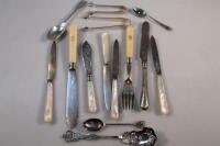 A group of assorted silver flatware and cutlery
