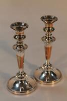 A pair of electroplated candlesticks