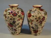 A pair of early 20thC Staffordshire pottery vases