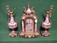 A 19thC French gilt metal and porcelain clock garniture