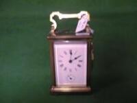 A brass cased carriage clock