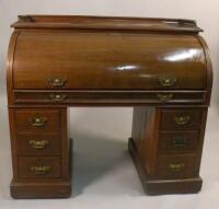 A late Victorian walnut cylinder desk