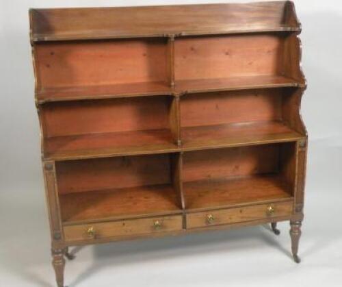 An early 19thC mahogany open waterfall type bookcase