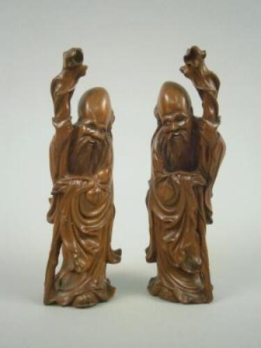 A pair of Chinese root carvings of immortals