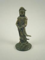 An oriental bronze figure of Guan Yin