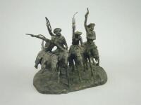 A Franklin Mint bronzed Wild West group after Frederick Remington