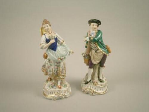 A pair of Dresden porcelain figures of a gentleman and lady