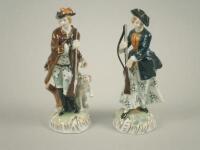 A pair of Dresden porcelain figures of a huntsman and lady