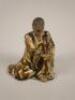 An early 20thC Chinese pottery figure of an old man